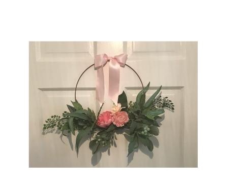 Put a beautiful floral hoop like this on your door to welcome Spring!