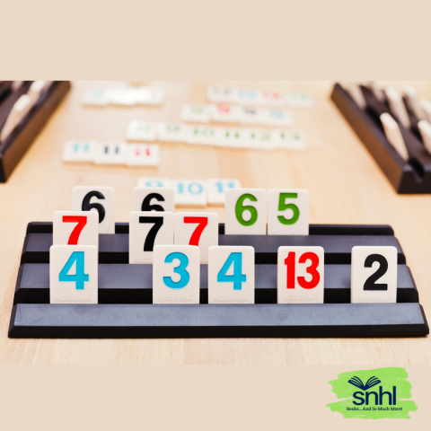 Multicolored Rummikub tiles in holder