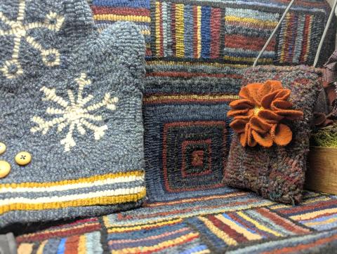 Colorful hooked rugs in a variety of patterns