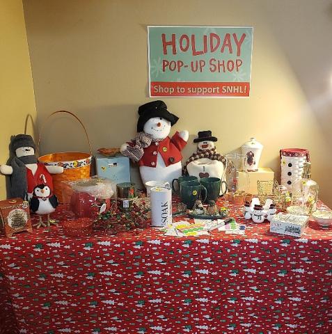 Table with red cloth and holiday items