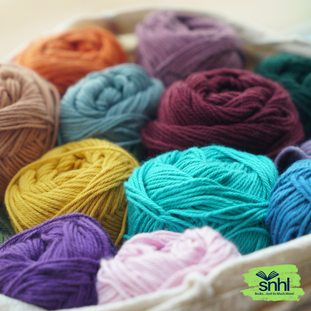 Basket of colorful yarns in loose balls