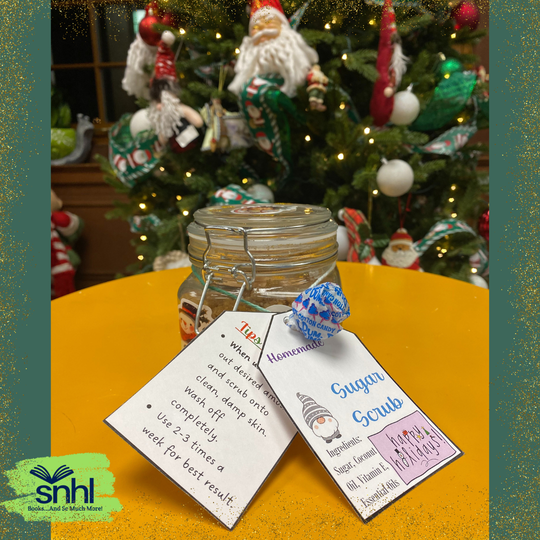 Sugar Scrub Jar with Labels on a table against a Christmas Tree background